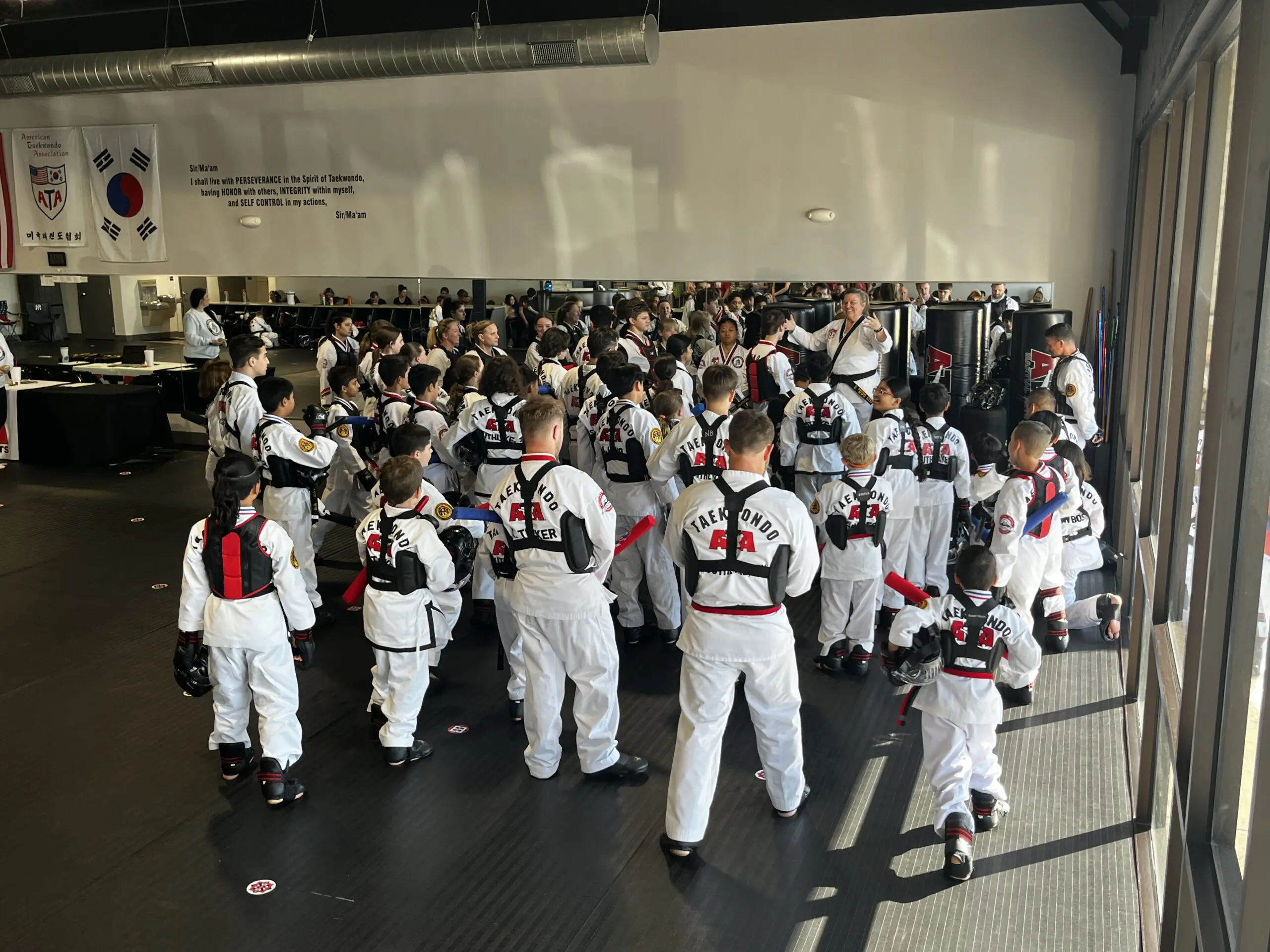 When a child attends a martial arts school, students learn Taekwondo through belt levels, develop self-defense skills, follow instructions, cultivate respect, build self-esteem and self-confidence, and understand the value of hard work.