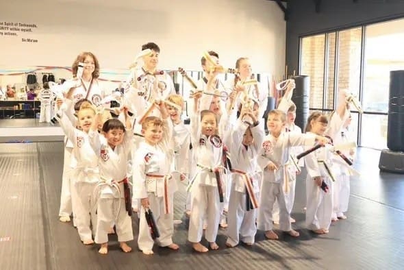 group of students that are having fun and being confident during preschool self defense classes