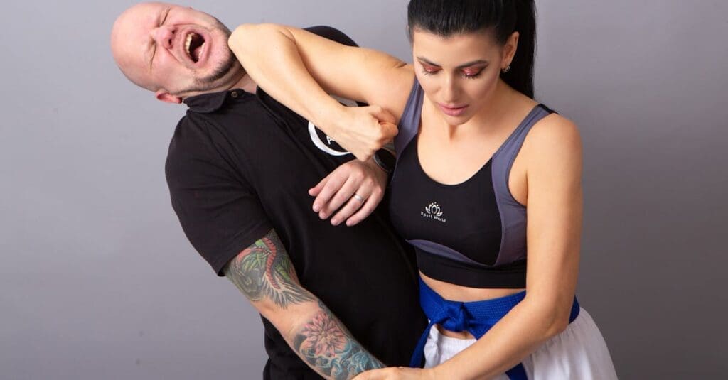 Woman practicing escape technique for self protection skills training