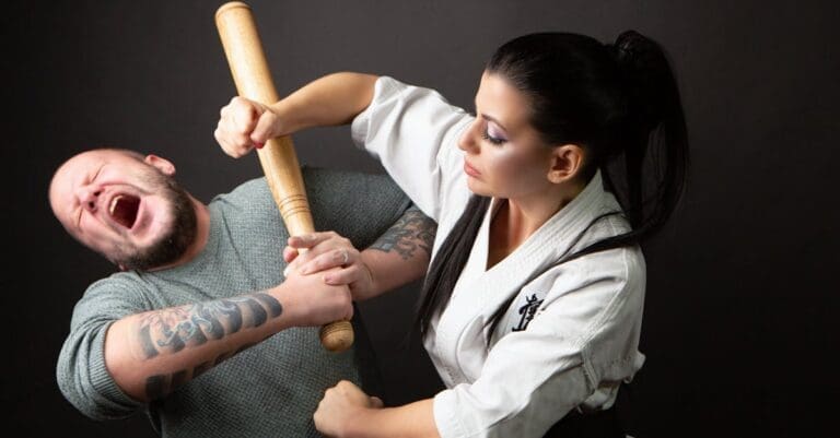 Woman demonstrating weapon defense during physical self protection skills practice