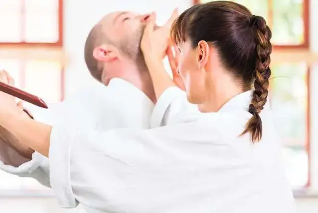 students practicing moves for adult martial arts lessons