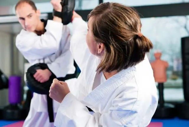 adult practicing drills for adult martial arts classes